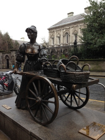 Molly Malone stands with her cart at the end of Grafton Street